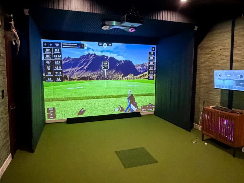 Custom golf simulator enclosure in a Texas home